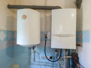 Tankless water heater near toilet in a home