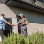 HVAC Contractor and homeowner shaking hands